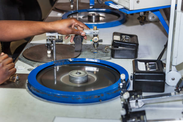 istock African woman working in a polishing machine 1188178435