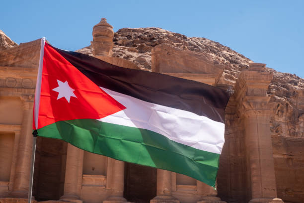 istock The Jordan flag in  Petra' 1188179213