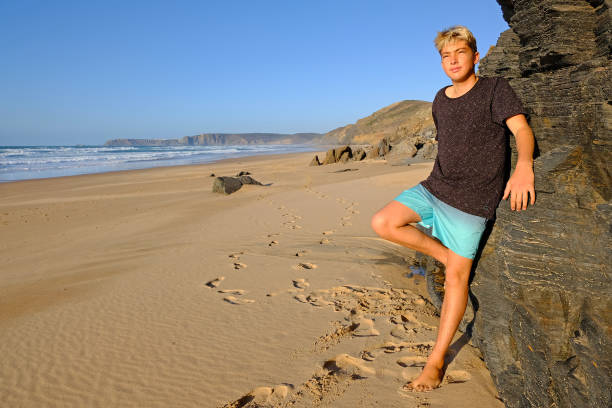 istock Young guy enjoying himself at the beach 1188181851