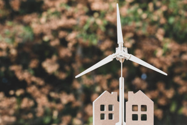 istock Ecology Power renewable energy future alternative with green environment and sustainable development concept, Home / wind turbine with blur background. Ideas for nature or eco environmental 1188189317