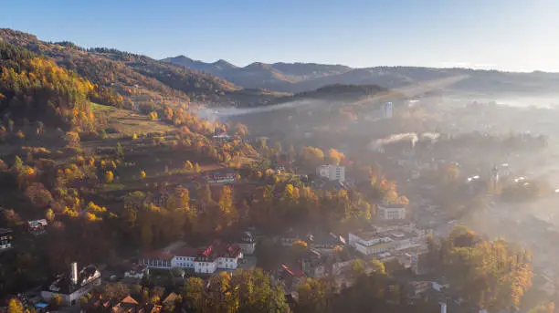 Foggy Sunrise Over Szczawnica City in Pieniny Mountains at Fall Season. Drone View.