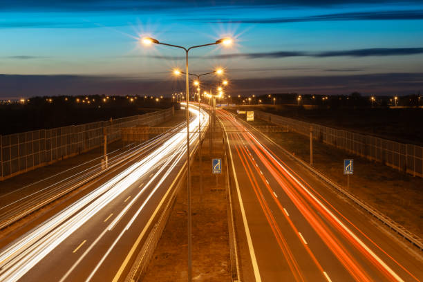 istock lights of cars with night 1188193151