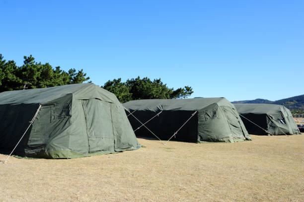 Military tent on the ground Military tent on the ground military base stock pictures, royalty-free photos & images