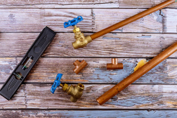 istock Set of brass plumbing fitting tools on wooden board 1188195174