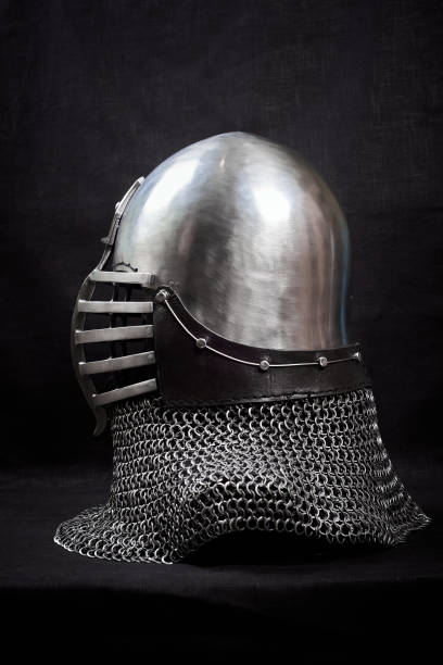 Knight helmet on a black background. Side view.