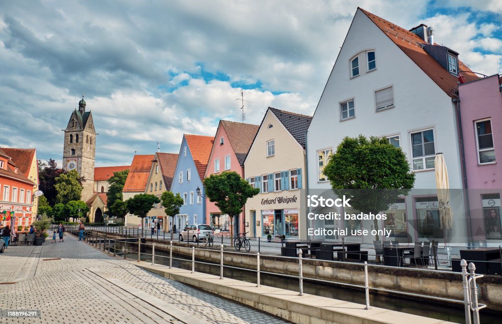Street with a canal in Memmingen, Germany. Germany, Memmingen - June 22, 2018: A street view with a canal in the center of the old city. Memmingen Stock Photo