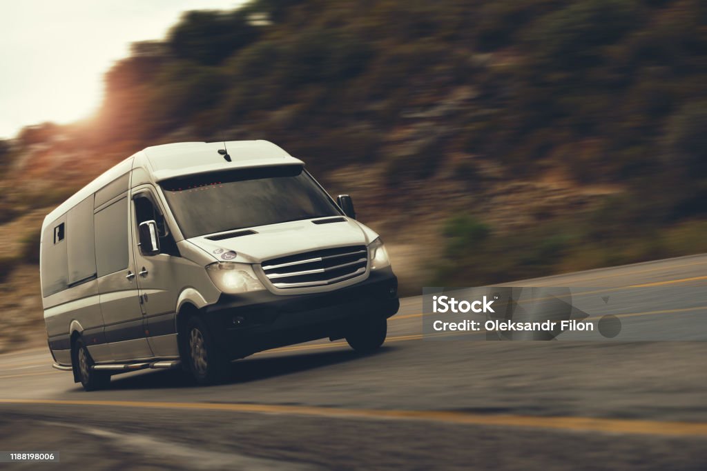 a rent bus is drive a rent bus is drive by highway Van - Vehicle Stock Photo