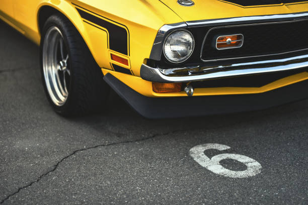 muscle car on parking lot with number six