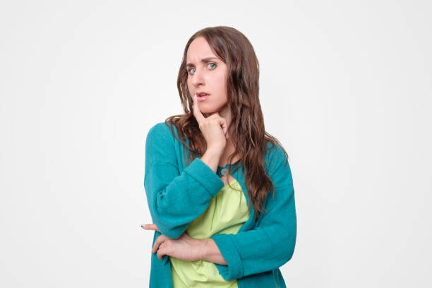 istock Thinking woman looking up trying to make a decision. 1188201619
