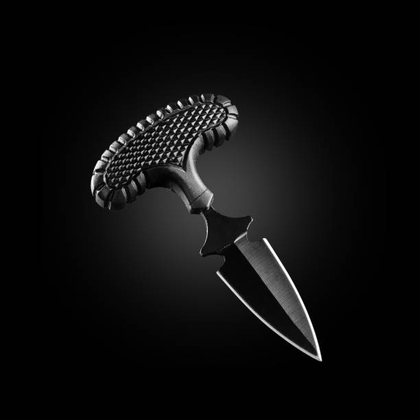 istock Beautiful shining knife on a black background. 1188202008