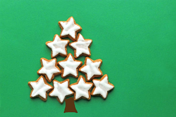 istock card with christmas tree laid with star cookies 1188202075