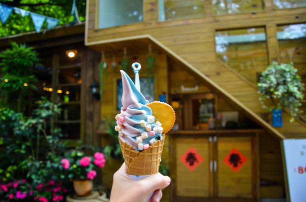 Miaoli, Taiwan - APR 14, 2019: Hand holding ice cream in Zhuo ye cottage.