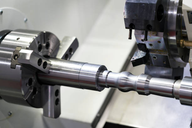 istock Operator machining automotive part by cnc turning machine, 1188204859