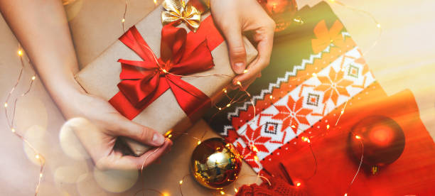 istock Red holiday scarf and christmas gift top view. 1188206581