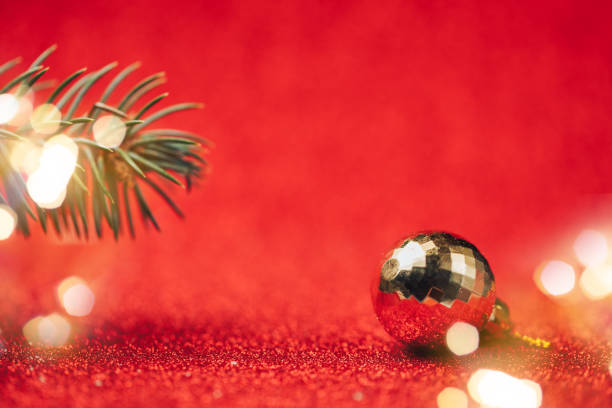 istock Yellow disco ball on red background close up. 1188206662