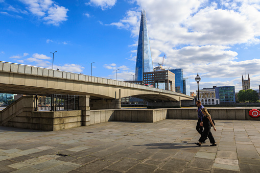 London - England - August 22, 2019:Overlooking the Shard Tower and the banks of Thames river below London Bridge