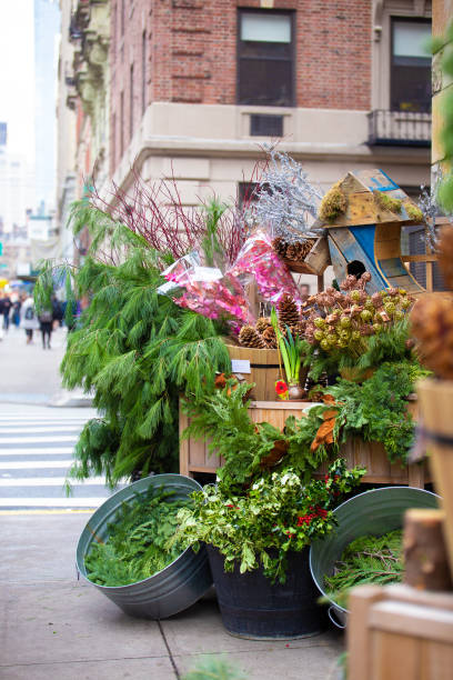 New York city Street Corner Christmas Sale New York City street corner during the Christmas Holiday season with decorations for sale city street street corner tree stock pictures, royalty-free photos & images