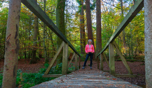 istock Woman in the forest in autumn 1188215590