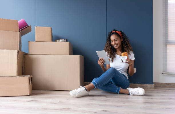 istock Woman eating while moving house 1188217267