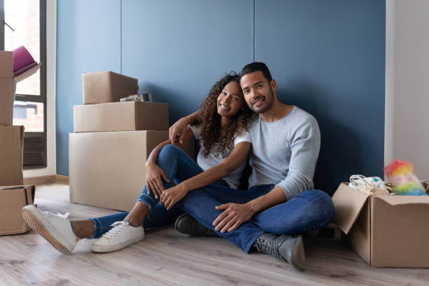 istock Loving couple moving house and taking a break from packing 1188217274