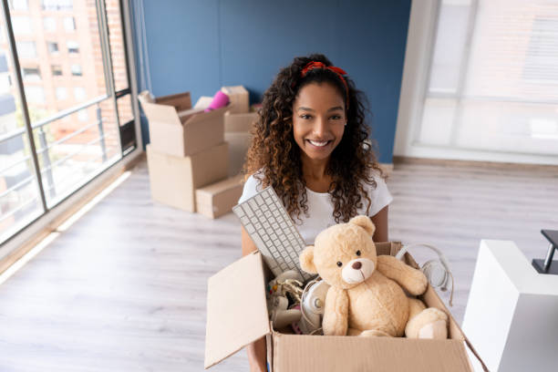 istock Happy woman moving house 1188217276