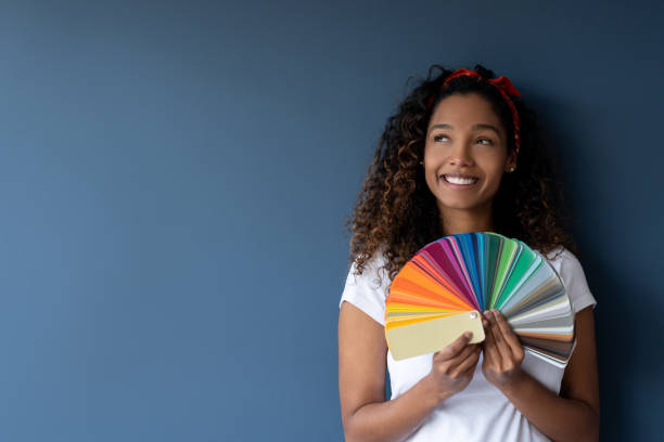 istock Woman thinking about painting her house 1188217330