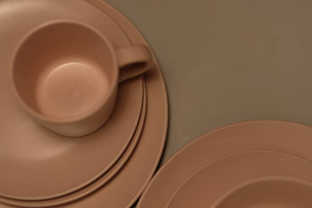 istock top view of brown cup and plates on gray table 1188218959