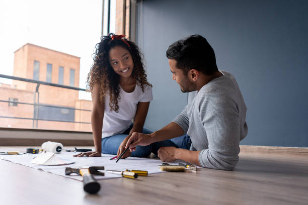 istock Happy couple remodeling their house 1188220321