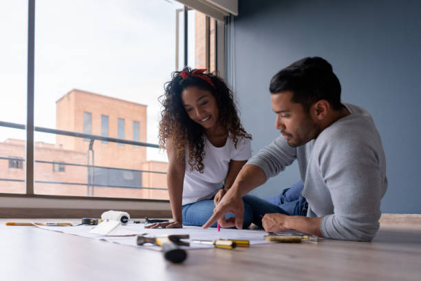 istock Loving couple working on a home improvement project 1188220345