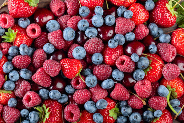istock Berries closeup colorful assorted mix. 1188221548