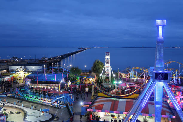 view of pier, funfair and thames estuary at night from southend on sea - rio carnival fotos imagens e fotografias de stock