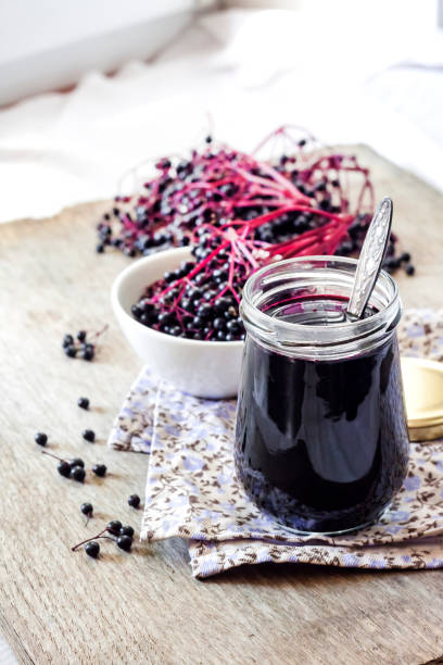 istock Homemade black elderberry syrup in glass jar 1188224738