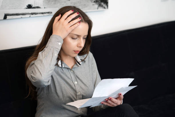 istock Young woman got a bad letter uvolnenii 1188224747