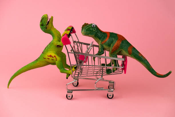 istock funny postcard with dinosaurs rolling each other in shopping cart 1188227800