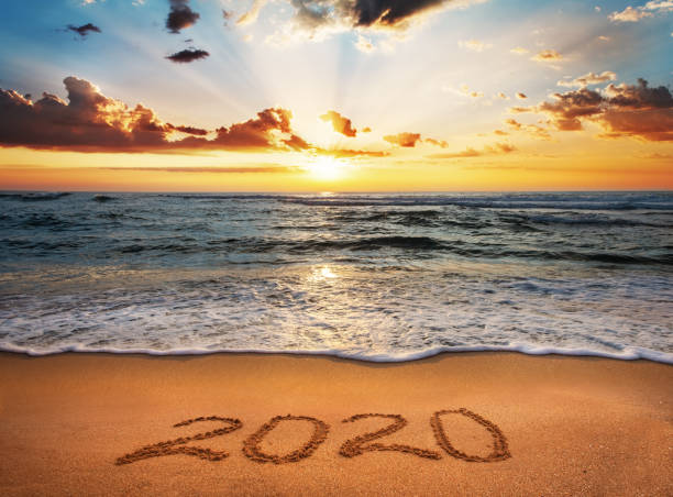 istock Happy New Year 2020! Written 2020 on the beach. 1188228788