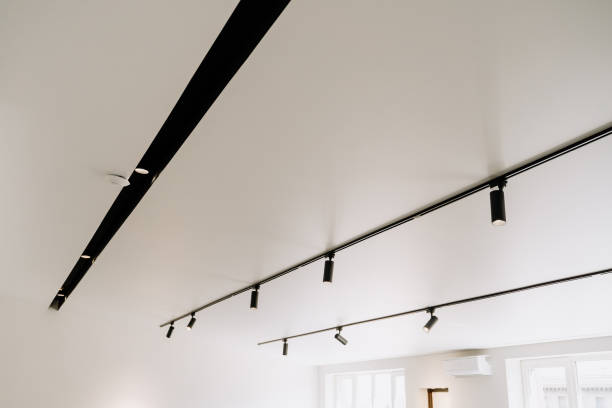 shine electric led spot light on white ceiling - light shop imagens e fotografias de stock