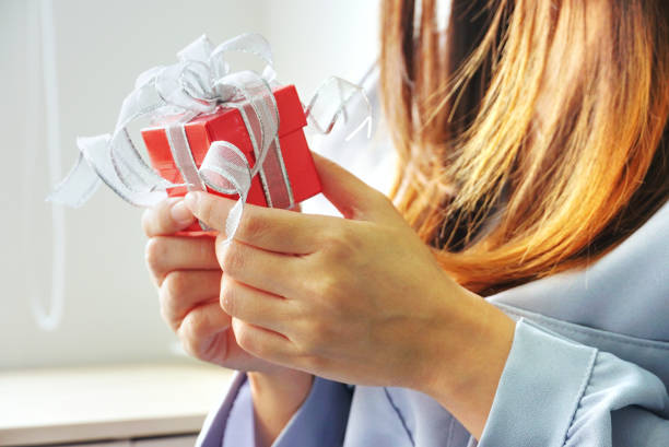istock Close up red surprise gift box on woman 's hand 1188230369
