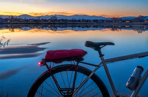 Photo of silhouette of a touring bike against sunset