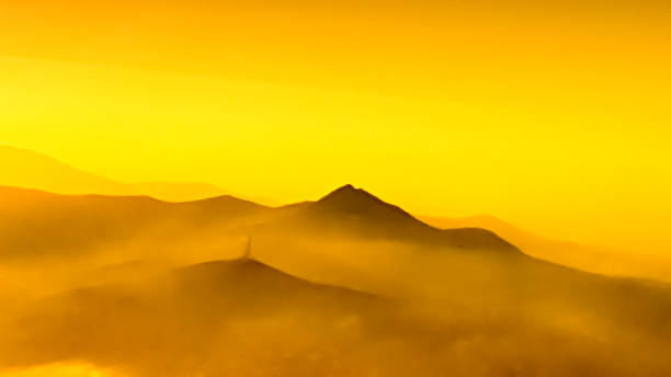 colorful mountains in clouds - like painting, defocused, abstract