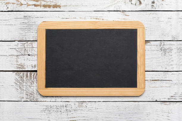 istock Small vintage blank chalkboard on an old wooden background 1188233084