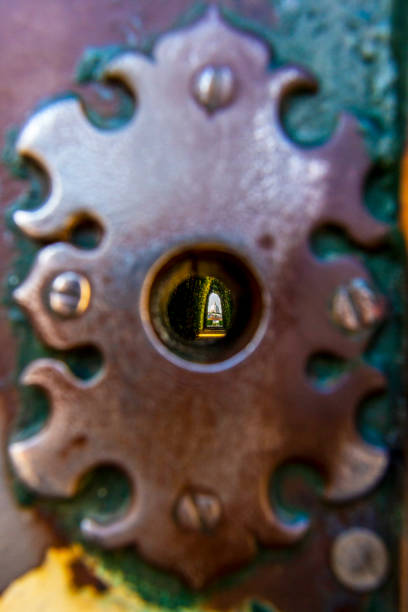 Saint Peter's Basilica through the Aventine Keyhole, Rome Distant view of Saint Peter's Basilica through the Aventine Keyhole, Il Buco Della Serratura, blurred escutcheon, abstract image in Rome, Italy knights of malta stock pictures, royalty-free photos & images