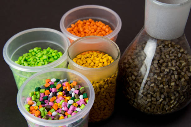 istock Plastic granules in a measuring container and test tubes in the laboratory. Plastic pellets. Plastic Raw material . BPA FREE 1188234453