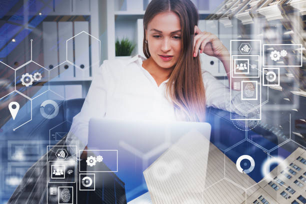 istock Woman with laptop in office, digital interface 1188234487