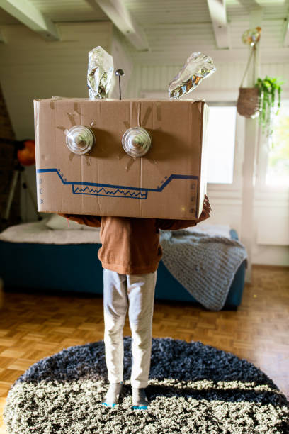 Small kid pretending to be a robot at home.