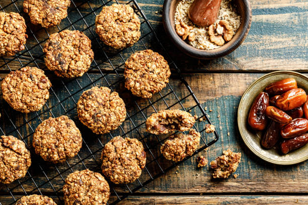 Healthy dessert. Homemade oatmeal cookies with dates and nuts, do not contain sugar, butter and eggs. Healthy dessert. Homemade oatmeal cookies with dates and nuts, do not contain sugar, butter and eggs. date fruit stock pictures, royalty-free photos & images