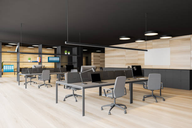 istock Dark gray open space office with mock up picture 1188235287