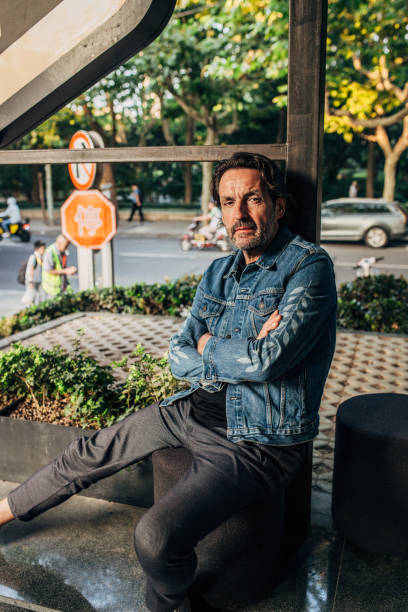 istock Mature man sitting outdoors 1188236092