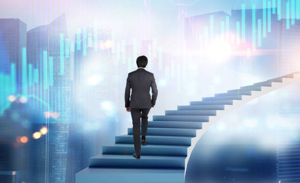 istock Man walking on stairs in city with graphs 1188236210