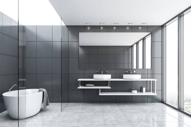 istock Gray tile and glass bathroom with tub and sink 1188236765