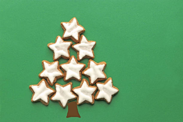 istock christmas card with tree laid with star cookies 1188236798
